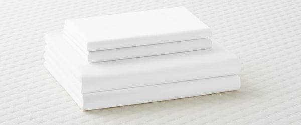 Stack of folded bed sheets