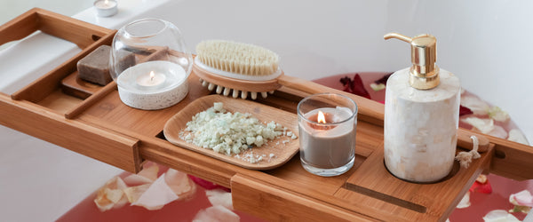 Wooden bathtub tray with luxury bath products