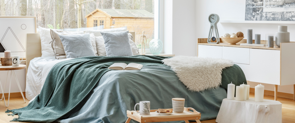 Bed with bright blue bedding