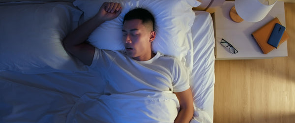 Man sleeping on full-size mattress
