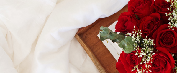 Bamboo sheets with tray and red roses