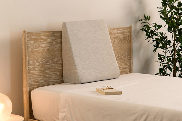 Wedge pillow for use as a back rest